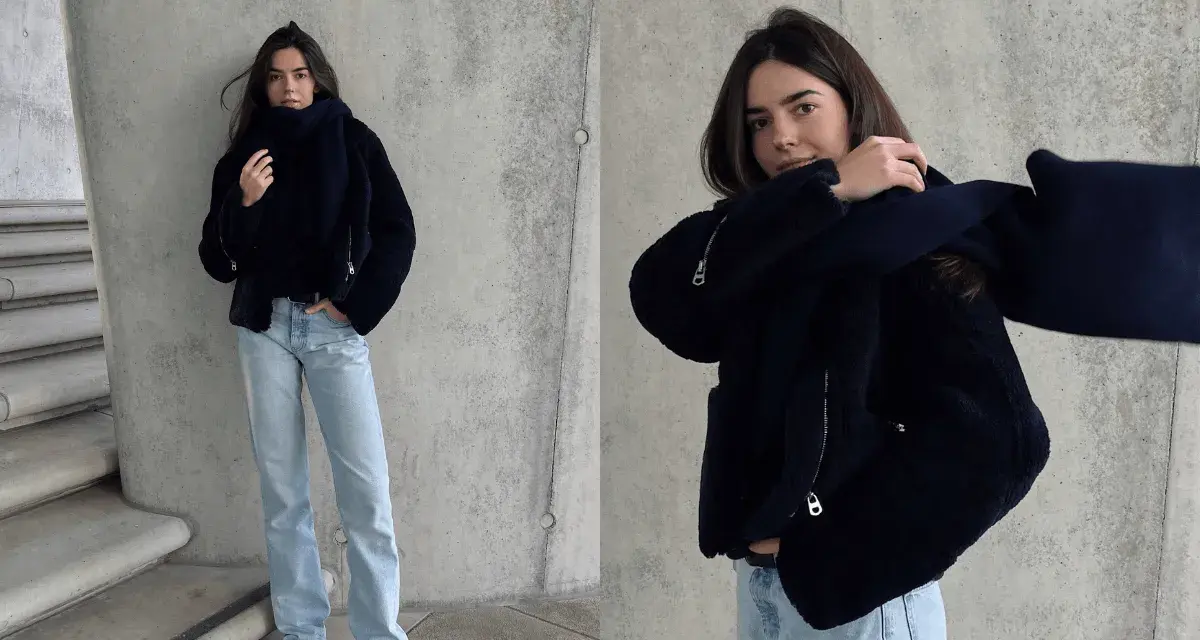 Stylisches Outfit für kalte Tage: Dunkelblaue Teddyjacke, passender Schal und helle Jeans. Perfekt für den Winter.