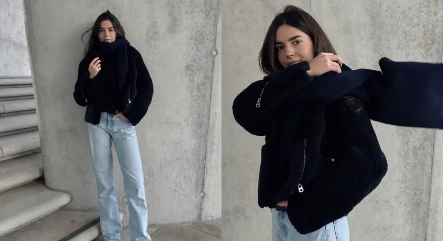 Stylisches Outfit für kalte Tage: Dunkelblaue Teddyjacke, passender Schal und helle Jeans. Perfekt für den Winter.