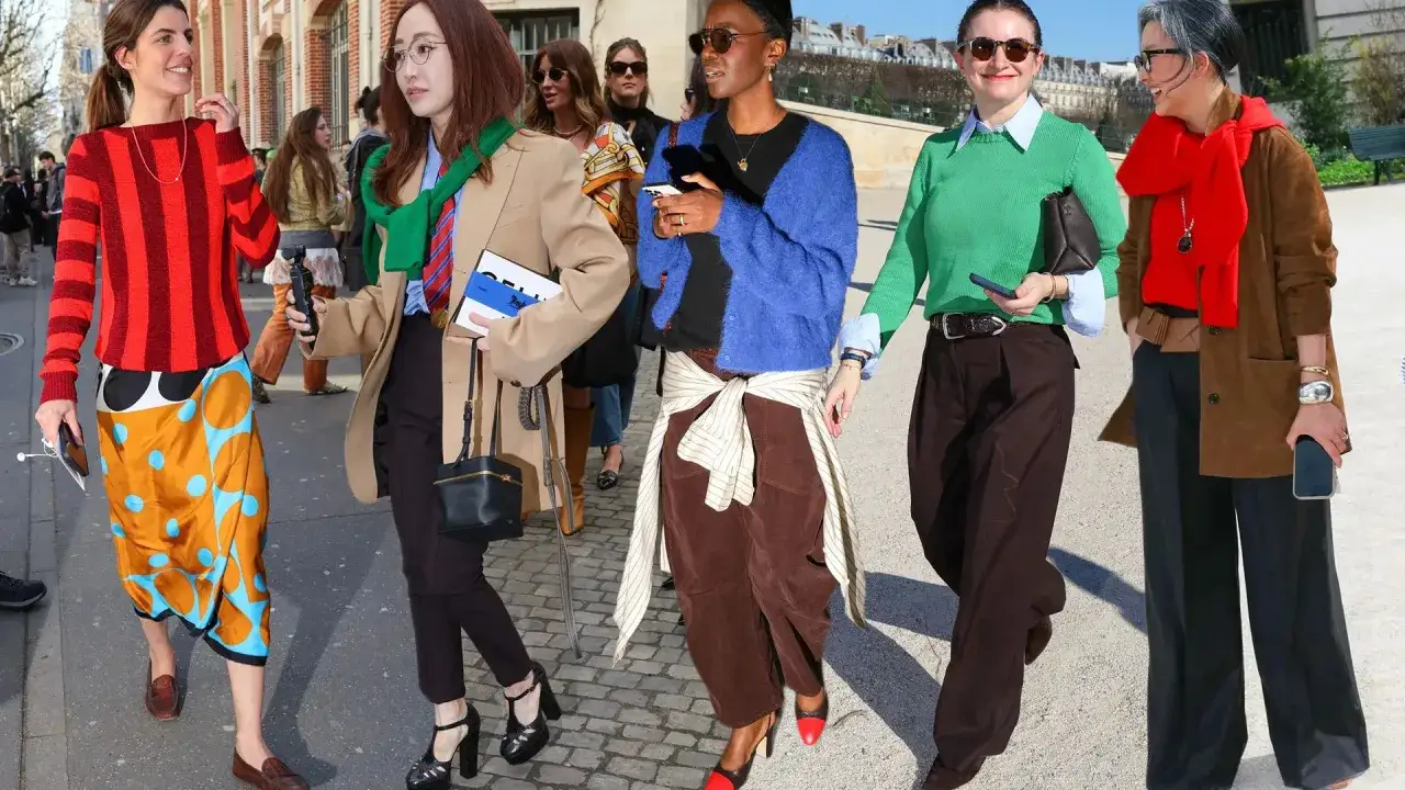 Menschen in bunten Outfits, die Dopamin-Dressing verk&ouml;rpern. Kr&auml;ftige Farben und Muster strahlen Freude aus.